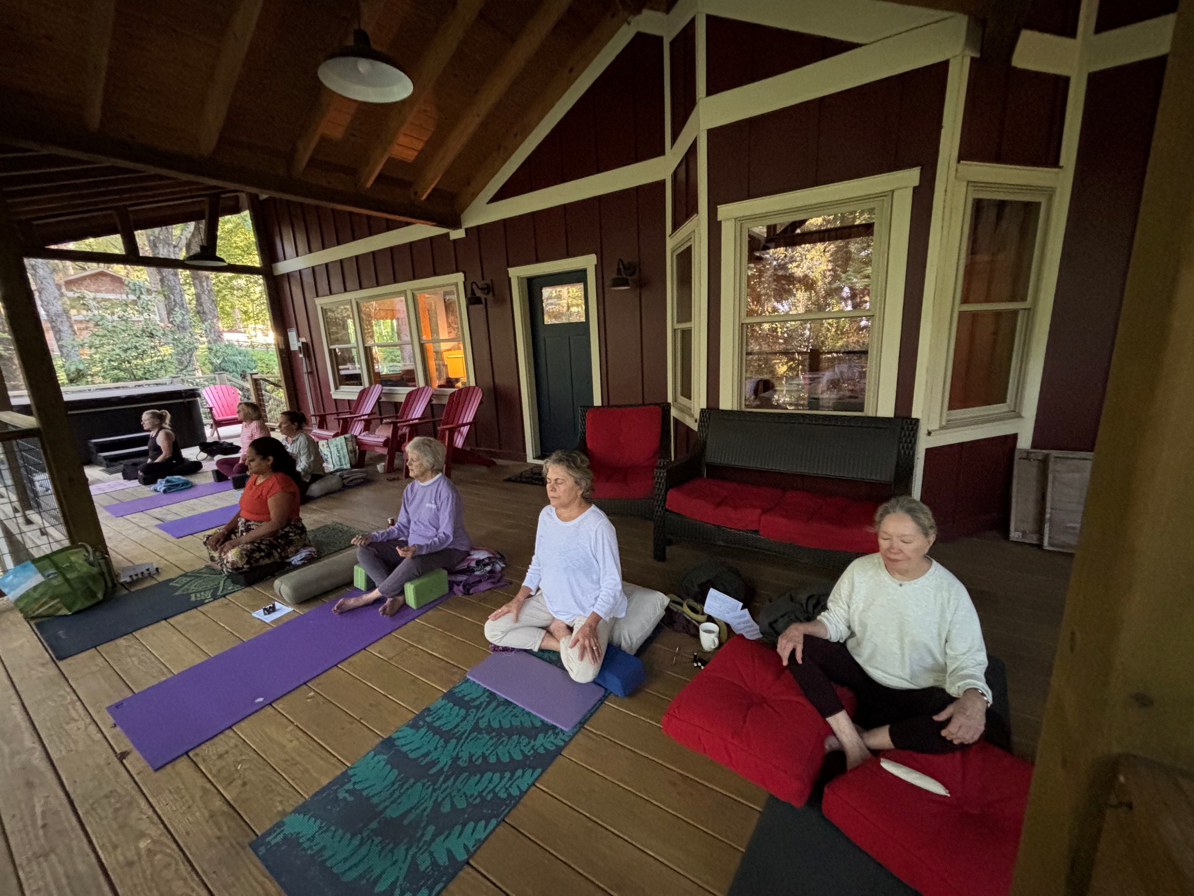 Group meditation on the covered porch