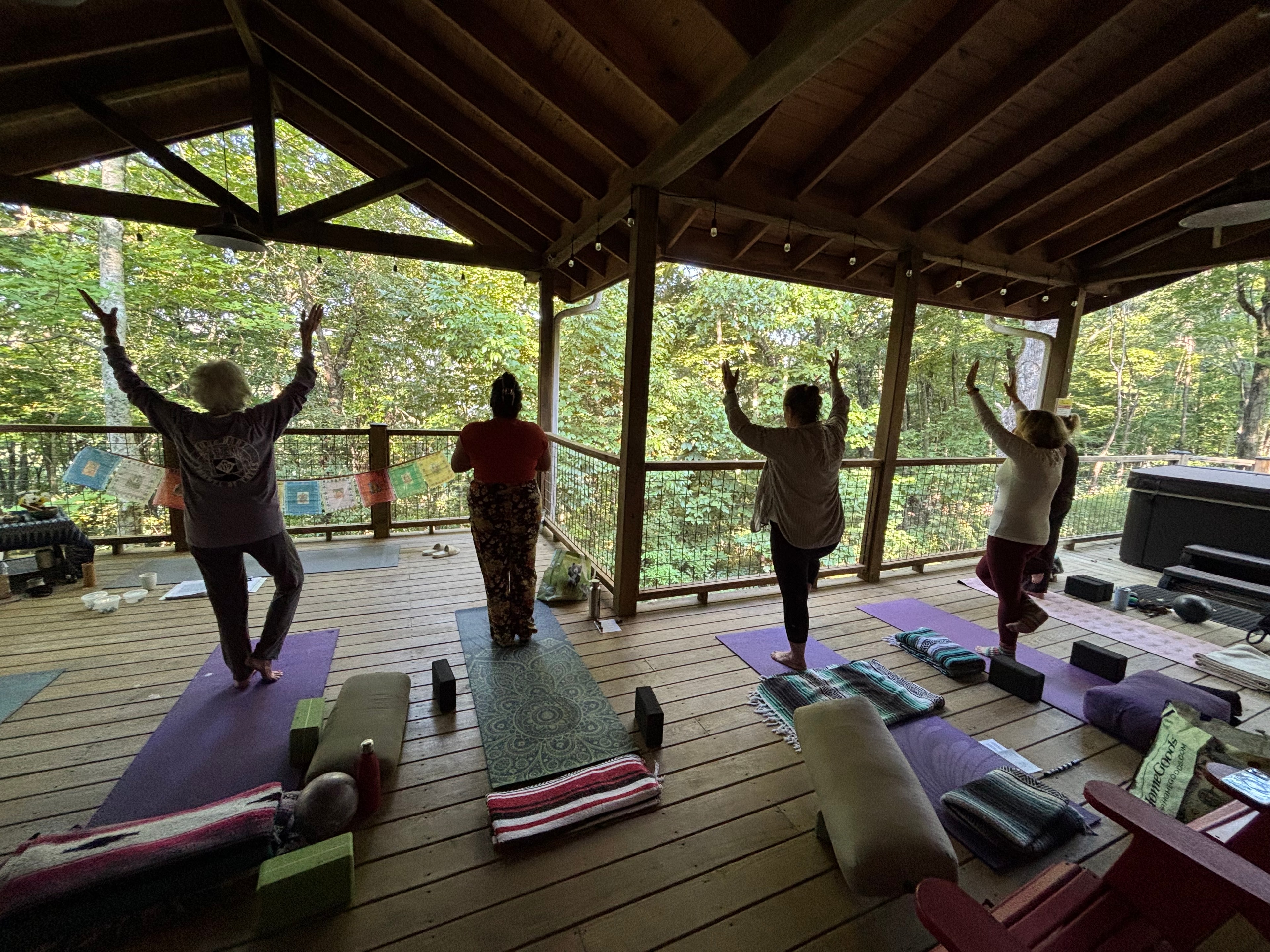 Morning yoga practice outdoors at the retreat